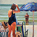 Woman Combing Hair on Beach